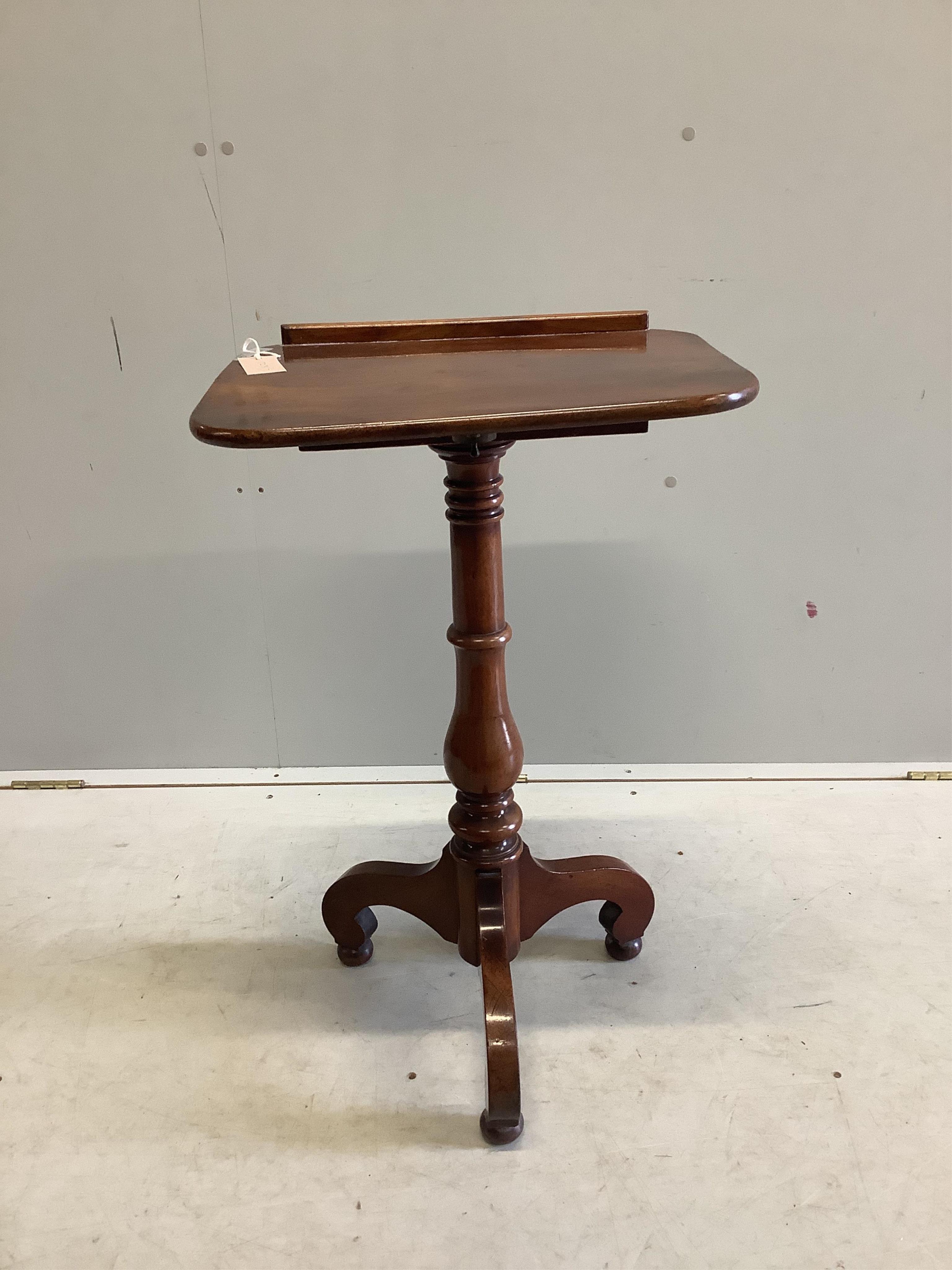 A Victorian mahogany reading table with tilt top, on tripod base, width 45cm, depth 35cm, height 90cm. Condition - fair